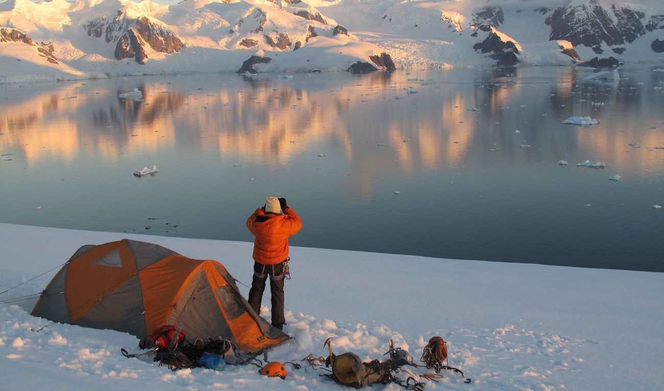 Lydia Bradey looks out at a snow capped mountain